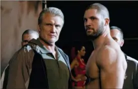  ?? BARRY WETCHER — METRO GOLDWYN MAYER PICTURES — WARNER BROS. PICTURES VIA AP ?? This image released by Metro Goldwyn Mayer Pictures / Warner Bros. Pictures shows Dolph Lundgren, left, and Florian Munteanu in a scene from “Creed II.”