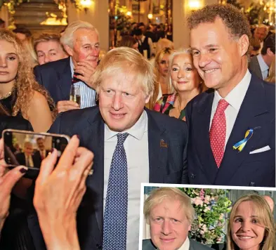  ?? ?? Special guest: Viscount Rothermere and his wife, Claudia, pose for pictures with Boris Johnson