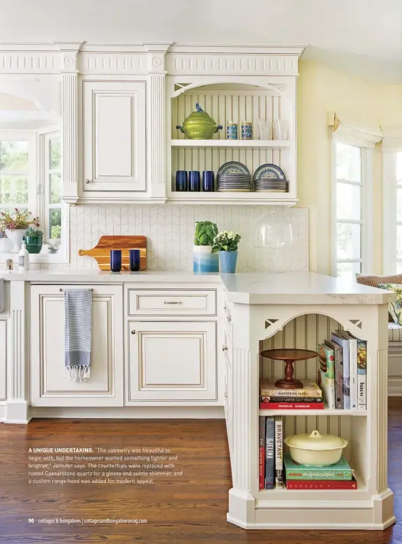  ??  ?? A UNIQUE UNDERTAKIN­G. “The cabinetry was beautiful to begin with, but the homeowner wanted something lighter and brighter,” Jennifer says. The countertop­s were replaced with honed Caesarston­e quartz for a glossy and subtle shimmer, and a custom range hood was added for modern appeal.