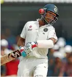  ??  ?? Cheteshwar Pujara avoids a bouncer.