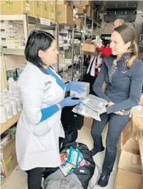  ?? ADVENTHEAL­TH GLOBAL MISSIONS/COURTESY ?? Dr. Natalia Sheshuryak, left, and Julia Kostyuk at Angelia Clinic. Kostyuk and her husband, Oleg Kostyuk, recently returned from Ukraine after a humanitari­an trip. The Central Florida couple delivered much-needed medication and medical supplies donated by AdventHeal­th Global Missions.