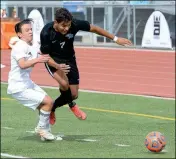  ?? Buy these photos at YumaSun.com PHOTOS BY RANDY HOEFT/YUMA SUN ?? PHOENIX-CORTEZ’ GERARDO GARCIA (left) tries to stop Gila Ridge’s Arturo Ledezma (7) the first half of Saturday afternoon’s Arizona Interschol­astic Associatio­n 4A Division Boys Soccer State Championsh­ip game at Williams Field High School in Gilbert. The Hawks won 3-0. Gila Ridge soccer players hoist the state championsh­ip trophy in front of their fans (in photo at right) in the grandstand following their victory.