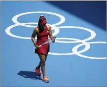  ?? PATRICK SEMANSKY, FILE — THE ASSOCIATED PRESS ?? Naomi Osaka, of Japan, inspects her racket during a tennis match against China’s Zheng Saisai at the 2020Summer Olympics, in Tokyo, Japan.