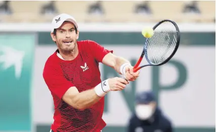  ?? Picture: Clive Brunskill/Getty ?? Andy Murray plays a backhand during his defeat by Stan Wawrinka