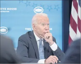  ?? SUSAN WALSH — THE ASSOCIATED PRESS ?? President Joe Biden listens during an event in the South Court Auditorium on the White House complex in Washington on Wednesday with cabinet officials and governors from Western states to discuss drought and wildfires.