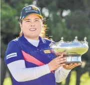  ?? AFP ?? Park In-Bee poses with the Australian Open trophy yesterday.