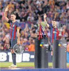  ?? REUTERS ?? Barcelona Jordi Alba and Sergio Busquets gesture after the La Liga match against Mallorca at Camp Nou on Sunday.