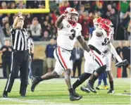  ?? PERRY MCINTYRE/GEORGIA PHOTO ?? Georgia junior inside linebacker Roquan Smith (3) celebrates after Lorenzo Carter recovers the fumble caused by Davin Bellamy in the final 90 seconds of last Saturday night’s 20-19 win at Notre Dame.