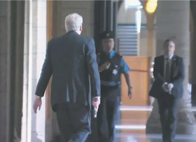  ?? Handout / The canadian
Press files ?? Kevin Vickers, left, the sergeant-at-arms of the House of Commons, is seen Oct. 22 in this still image from a CBC video after shooting Michael Zehaf-Bibeau.