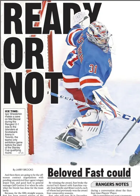  ?? AP (2) ?? ICE TIME: Igor Shesterkin makes a save on Mat Barzal during the Rangers’ 2-1 loss to the Islanders at Scotiabank Arena in Toronto, the teams’ only exhibition game before the start of the Stanley Cup qualifying round.