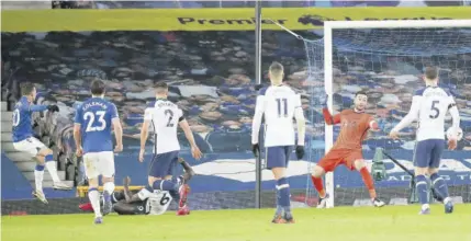  ?? (Photo: AFP) ?? Everton’s Brazilian striker Bernard (left) scores his team’s fifth goal during the English FA Cup fifthround football match between Everton and Tottenham Hotspur at Goodison Park in Liverpool, northwest England, yesterday.