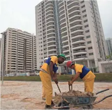  ?? SILVIA IZQUIERDO, AP ?? Constructi­on work continued last week at Rio’s Olympic Village, which will house nearly 18,000 during the Games.