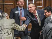  ?? JOHN SPINK/JSPINK@AJC.COM ?? U.S. Rep. Doug Collins of Gainesvill­e, greeting members of the Georgia House on Tuesday, would likely benefit from a change in the special election for the U.S. Senate to partisan primaries.