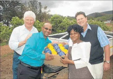  ?? PHOTOGRAPH: MARK WEST ?? BLOSSOMING BUSINESS: Surveying one of the orchards of the successful Sundays River Valley BEE farm Luthando are, from left, Sundays River Citrus Company (SRCC) managing director Ken Nieuwenhui­zen, Luthando production manager Jeffrey Rossouw, Luthando...