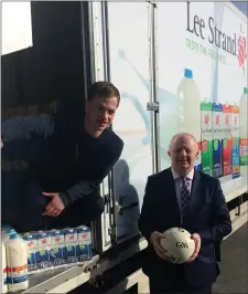  ??  ?? Pádraig Ó Sé collecting milk for the Comórtas teams from Lee Strand Managing Director John O’Sullivan.