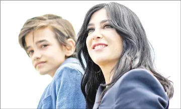  ?? — AFP photo ?? Syrian actor Zain al-Rafeea (left) and Lebanese director and actress Nadine Labaki pose on May 18 during a photocall for the film ‘Capharnaum’ at the 71st edition of the Cannes Film Festival in Cannes, southern France.