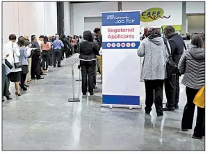  ?? Atlanta Journal-Constituti­on via AP/BOB ANDRES ?? Applicants line up for the opening of a job fair at Hartsfield Jackson Airport in Atlanta last month. Payroll processor ADP reported Wednesday that U.S. companies added 241,000 new employees in March.