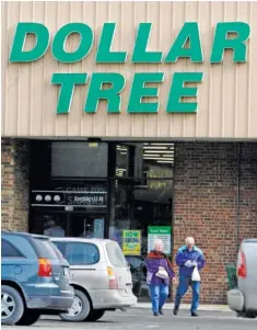  ?? AP FILE PHOTO/TOBY TALBOT ?? Customers walk out of a Dollar Tree Store in Barre, Vt.