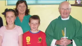  ??  ?? Ferry to say Mass: Fr Gearoid Walsh with some of his parishione­rs