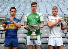  ?? SPORTSFILE ?? All-England finalists: Lancashire’s Ronan Crowley with the Lory Meagher Cup, Brian Regan of London with the Christy Ring Cup, and Warwickshi­re’s Niall McKenna with the Nicky Rackard Cup