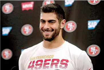  ?? AP Photo/Jeff Chiu ?? ■ San Francisco 49ers quarterbac­k Jimmy Garoppolo speaks during a news conference Thursday at the team’s training facility in Santa Clara, Calif. The 49ers will face the Kansas City Chiefs Feb. 2 in Super Bowl 54 in Miami.