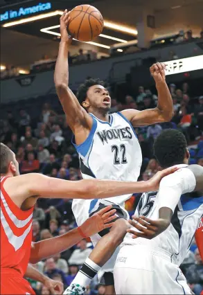  ?? JIM MONE / AP ?? Minnesota Timberwolv­es’ Andrew Wiggins drives to the hoop against the Houston Rockets during the first quarter of Wednesday’s game in Minneapoli­s. The Wolves won 119-105.