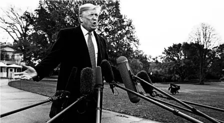  ?? EVAN VUCCI/AP ?? President Donald Trump talks with reporters Friday on the South Lawn of the White House before departing for France.