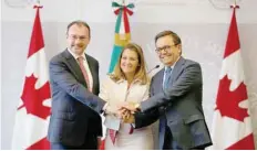  ?? — Reuters ?? Mexico’s Foreign Minister Luis Videgaray, Canada’s Foreign Minister Chrystia Freeland and Mexico’s Economy Minister Ildefonso Guajardo pose for a picture after delivering a joint message in Mexico City on July 25.