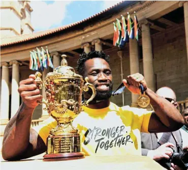  ?? /Freddy Mavunda ?? Winner: World Cup-winning Springbok captain Siya Kolisi greets the crowd during the parade of the Webb Ellis Cup at FNB Stadium in Johannesbu­rg.