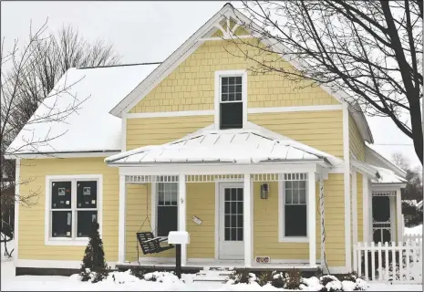  ?? (Hannah Hubbard/Ludington Daily News via AP) ?? Keith and Suzette Kolfage, the owners of 508 N. Robert St., in Ludington, Mich., shown on Feb. 9, found historical items while renovating during the past few months.