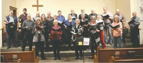  ?? [VERONICA REINER / THE OBSERVER] ?? Members of the Elmira Mennonite Church choir rehearse for the Christmas Eve presentati­on of Silent Night. The production, directed by Gord Davis, presents the song in its full historical context. The service is open to all.