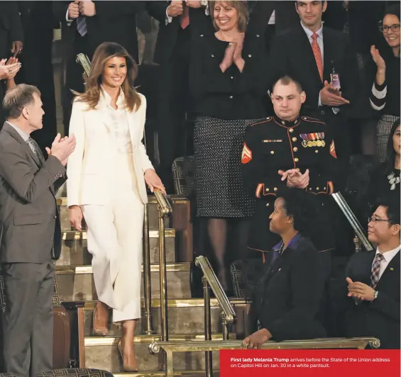  ?? J. Scott Applewhite / Associated Press ?? First lady Melania Trump arrives before the State of the Union address on Capitol Hill on Jan. 30 in a white pantsuit.