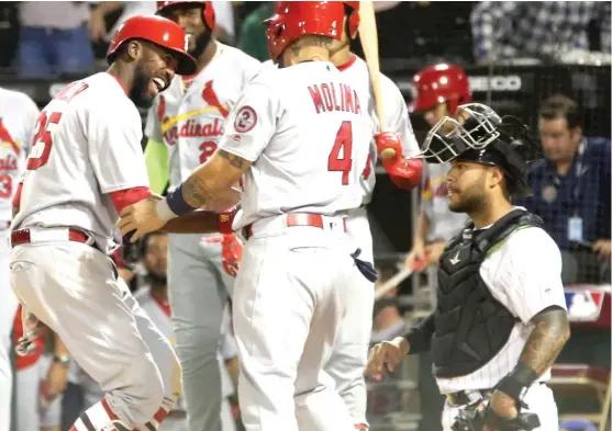  ?? PATRICK KUNZER/AP ?? White Sox catcher Omar Narvaez looks on as Dexter Fowler celebrates his grand slam in the Cardinals’ seven-run sixth inning Tuesday at Guaranteed Rate Field.