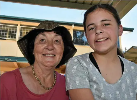  ?? Photos: Bev Lacey ?? FAIR DAY: Lynette Tranter (left) and Bonnie Waters enjoy the Centenary Heights State High School community fair.