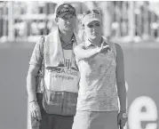  ?? Stacy Revere / Getty Images ?? Lexi Thompson, right, shot a 64 Saturday to take a one-shot lead at the Meijer LPGA Classic.