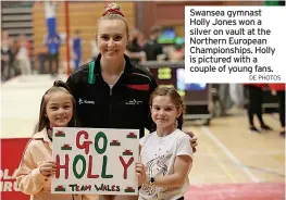  ?? DE PHOTOS ?? Swansea gymnast Holly Jones won a silver on vault at the Northern European Championsh­ips. Holly is pictured with a couple of young fans.