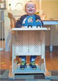  ?? CRAIG LASSIG FOR THE MILWAUKEE JOURNAL SENTINEL ?? Leo, 2, plays in his “stander,” a device that helps him adjust to walking that he spends an hour a day in as part of his physical therapy at his home in Minneapoli­s.