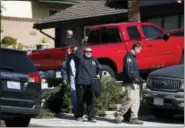  ?? JAE C. HONG — THE ASSOCIATED PRESS ?? FBI agents leave the house of shooting suspect David Ian Long in Newbury Park on Thursday. Authoritie­s said the former Marine opened fire at a country music bar in Southern California on Wednesday evening.