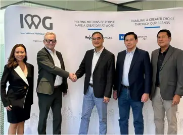  ?? ?? HAPPY Coral Way Realty Corporatio­n and Internatio­nal Workplace Group formalized their partnershi­p during a contract signing event at SPACES 29F World Plaza, 4th Avenue, BGC.