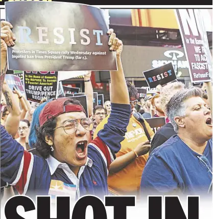  ??  ?? Protesters in Times Square rally Wednesday against bigoted ban from President Trump (far r.).