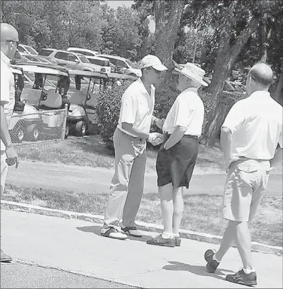  ??  ?? President Barack Obama greets Ald. Ed Burke at the Beverly Country Club on Sunday. | JAMES RAYMOND PHOTO