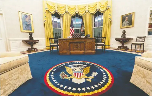  ?? ALEX BRANDON / THE ASSOCIATED PRESS ?? The Oval Office of the White House is newly redecorate­d for the first day of President Joe Biden’s administra­tion,
including a deep blue carpet with the presidenti­al seal in the middle.