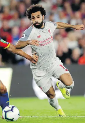  ?? KIRSTY WIGGLESWOR­TH / THE ASSOCIATED PRESS ?? In his first full season in English soccer Mohamed Salah scored more goals (32) in a 38-game Premier League campaign than any other player.