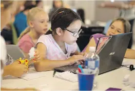  ??  ?? Students attend the Girls Learning Code computer workshop in Toronto.