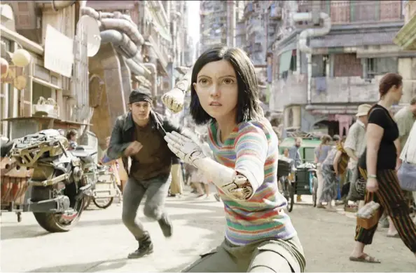  ?? 20Th cenTurY Fox ?? Keean Johnson, left, and Rosa Salazar star in the heavily computeriz­ed Alita: Battle Angel, which is now in theatres.