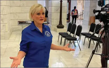  ?? (AP/Andrew DeMillo) ?? Melissa Fults, executive director of Arkansans for Cannabis Reform, talks to reporters Wednesday at the Arkansas state Capitol in
Little Rock. Fults, a longtime advocate for marijuana legalizati­on, is opposing a measure on the ballot in Arkansas to legalize recreation­al marijuana.