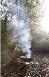  ??  ?? Right Gardener Fern Alder makes charcoal in the forest clearing at the end of her woodland garden. The wood will smoke for a few hours while the gases are released, but the charcoal won’t be ready until the following day.