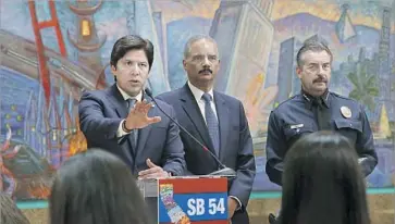  ?? ALLEN J. SCHABEN Los Angeles Times ?? CALIFORNIA Senate leader Kevin de León, left, fields questions on the “sanctuary state” bill as former U.S. Atty. Gen. Eric H. Holder Jr. and Police Chief Charlie Beck listen at a news conference in Los Angeles in June.