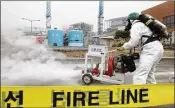  ?? PARK JIN-HEE / XINHUA 2013 ?? A South Korean firefighte­r participat­es in a training for chemical accidents in a thermal power plant in Seoul, South Korea.