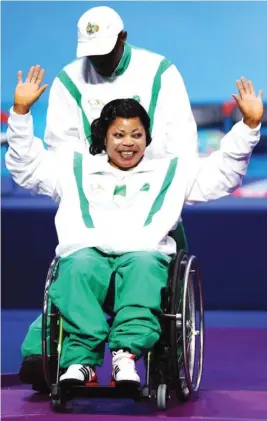  ??  ?? Team Nigeria captain, Lucy Ejike acknowledg­ing cheers from the fans. She won a gold medal for Nigeria in Powerlifti­ng in Rio